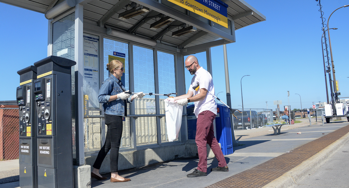 Metro Transit employees volunteer to pick up trash as part of the Adopt A Stop program.