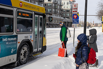 Northstar in snow Customers boarding a bus in the snow