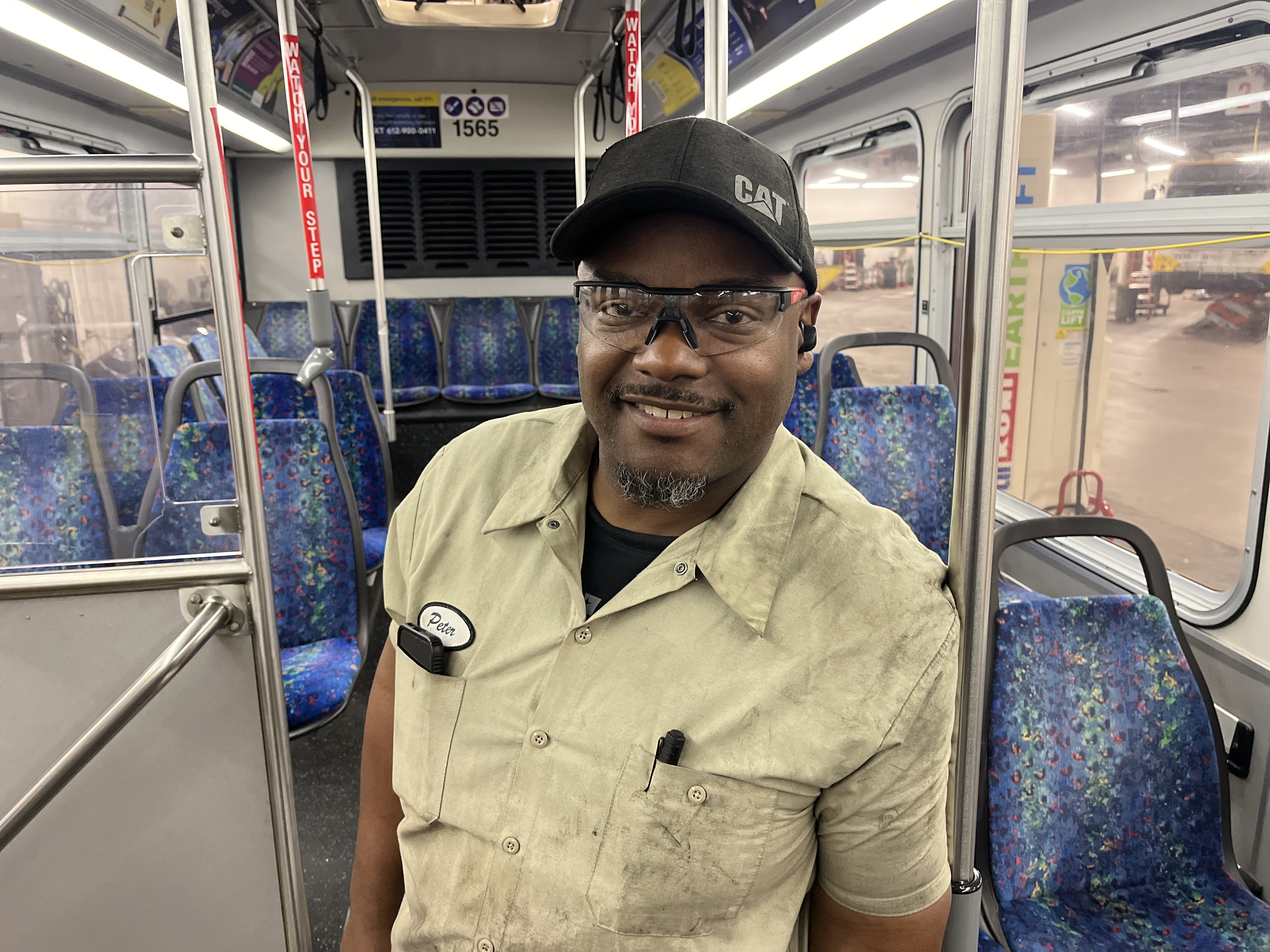 Helper Peter Lockhart inside a Metro Transit bus. 