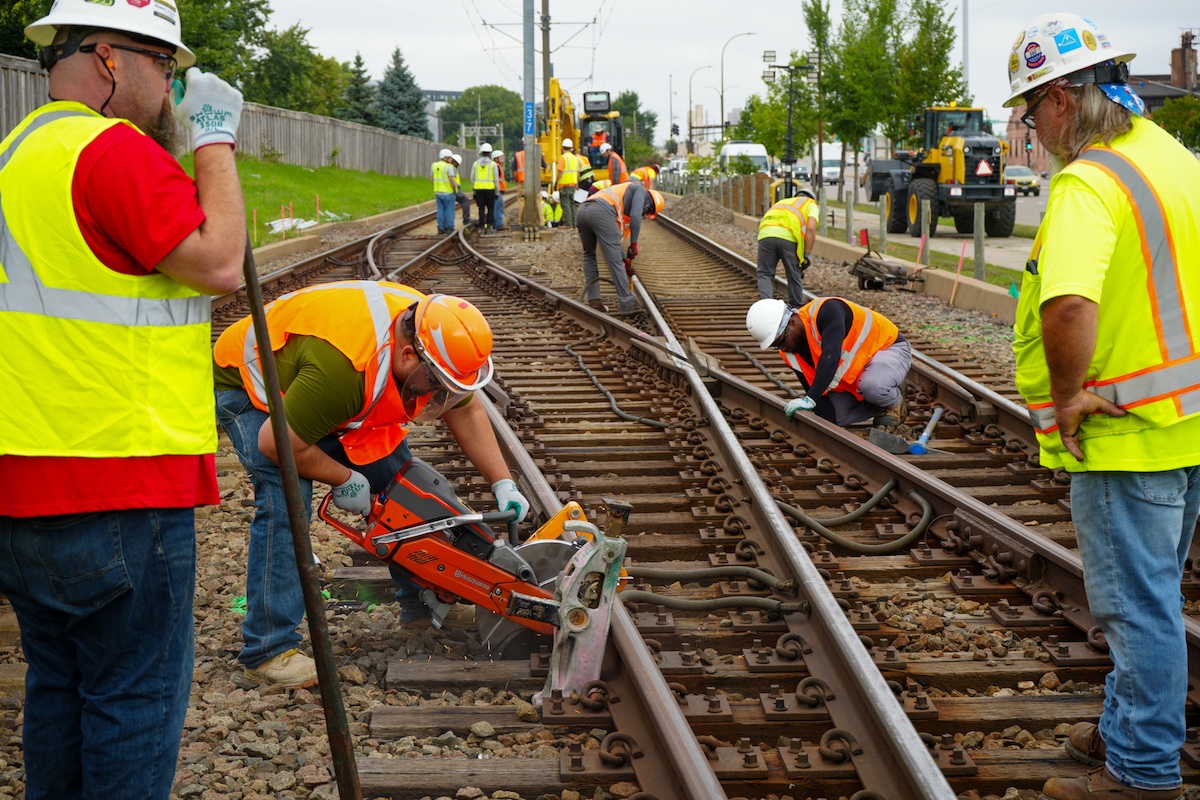 Workers conducting track maintenance.